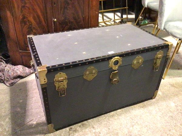 A vintage travelling trunk with grey exterior and handles to sides (51cm x 91cm x 51cm)