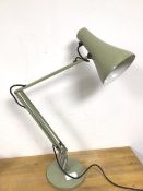 An anglepoise adjustable lamp, in an olive green finish, on circular base (78cm)