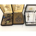 A collection of Scottish jewellery including silver and white metal stick pins, some with polished