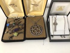 A collection of Scottish jewellery including silver and white metal stick pins, some with polished