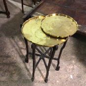 A Chinese brass tray on stand, the tray with raised scalloped edge with engravings depicting two