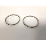 A pair of sterling silver bangles with inset rope pattern design (6.5cm) (combined: 42g)