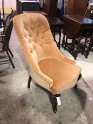 An early 20thc library chair, with an upholstered buttoned back and seat, on cabriole front supports