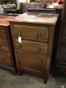 An Edwardian side cabinet, with ledge back above rectangular top, with moulded edge, above two