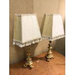 A pair of table lamps, gilt composition, with shades (74cm)