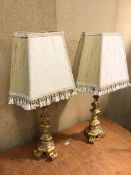 A pair of table lamps, gilt composition, with shades (74cm)
