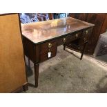 An early 20thc Georgian style writing desk, the rectangular top with glass top above a central