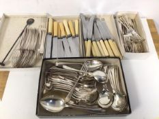 A quantity of cutlery including knives, forks, fish knives, bone handled knives, table spoons,