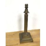 An Edwardian brass table lamp, in the form of a column with stepped base (41cm)