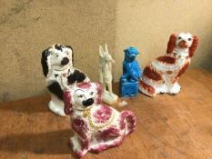 Three 19thc polychrome chimney spaniels (tallest: 25cm), a blue dog of fou and a stone Egyptian