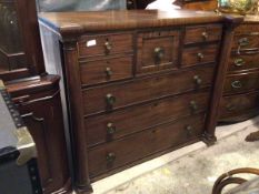 A 19thc mahogany chest of drawers, the inverted top above a central square drawer, flanked by a