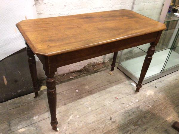 A late 19thc/early 20thc mahogany side table, the rectangular top with canted corners and moulded