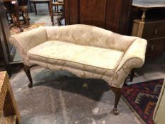 A small window seat or child's sofa, 1930s/40s, with arched back and scroll arms, in a foliate