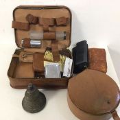A 1920s/30s travelling toiletry set with brushes, canisters, mirror etc., with two vintage leather