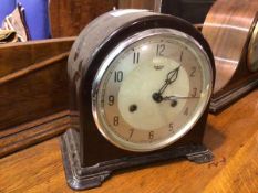 A 1930s/40s mantel clock, the circular dial inscribed Smith's, Enfield (20cm x 22cm x 12cm)