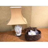 A Chinese pierced ceramic table lamp (49cm to top of shade), a wicker fishing creel with quantity of