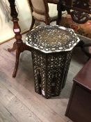A Middle Eastern octagonal table, with mother of pearl and bone inlaid decoration (49cm x 36cm) (a/