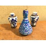 An Iznik vase, with character to base (15cm) and two Chinese baluster shaped vases, both with four