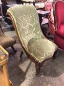 A Victorian walnut slipper chair, the scroll top with moulded sides, upholstered in a cut velvet