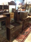 A dressing table, the hinged rectangular mirror with surmount with naturalistic carving, flanked