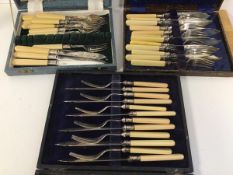 Three boxed sets of cutlery, all with bone handles, including forks and fish knives (a lot)
