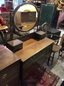 An Edwardian dressing table, the oval bevelled mirror above two trinket dishes, on moulded