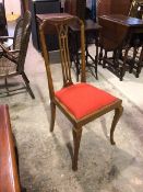 An Edwardian side chair with pierced splat above a red upholstered drop in seat, on cabriole front