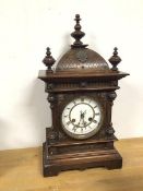 An early 20thc oak mantel clock of architectural form, with roman numerals (50cm x 28cm x 15cm)