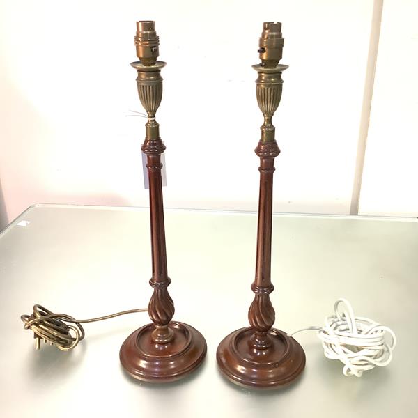 A pair of George III style brass-mounted mahogany candlesticks, c. 1900, fitted as table lamps, each