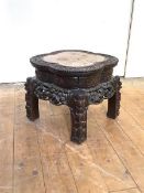 A Chinese rosewood jardiniere stand, late 19th century, the lobed circular top with inset rouge