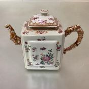A Chinese Export porcelain teapot, of oblong form, each side with raised panel, decorated in a
