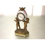 A French lady's gilt-metal and porcelain dressing table clock, c. 1900, in 18th century style, the