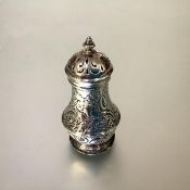 A George II silver pepperette, Benjamin West, London 1742, of baluster form, chased with