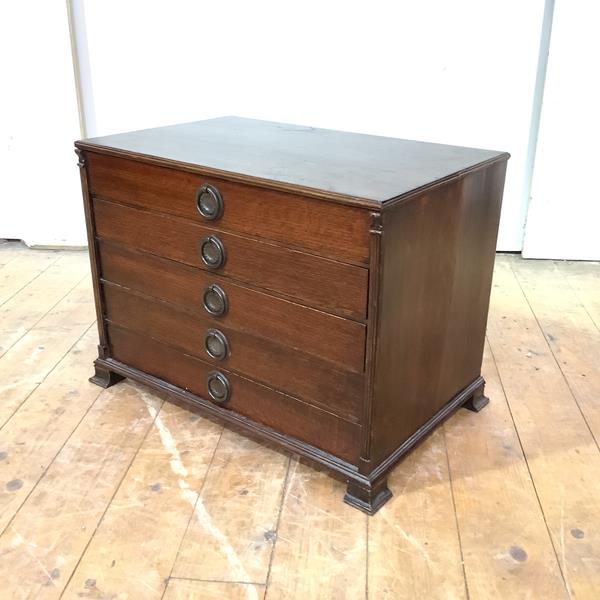 A miniature or table top oak and walnut chest, early 20th century, fitted with five drawers
