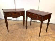 A near pair of French Empire mahogany pier tables, 19th century, each moulded top with sloping sides