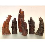 A group of six Chinese carved buffalo horn figures, 19th and 20th centuries, comprising: a