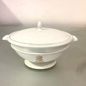 A Sevres porcelain tureen and cover, c. 1840, glazed in the white, circular, with shaped fluted