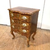 A French walnut serpentine chest, 20th century, the crossbanded and satinwood-strung top over