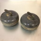 A pair of early 20th century granite curling stones, of characteristic form, the handle plates
