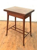 An Edwardian mahogany card table, the moulded top with boxwood, mother-of-pearl and white metal
