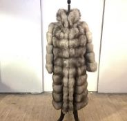 A striking full length silver fox fur coat, 1980's, with retailer's name to the lining 