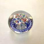 A Baccarat millefiori mushroom paperweight, mid-19th century, the central tuft within a blue and