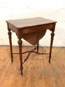 A Victorian figured walnut work table, the quarter-veneered top with floral boxwood inlay lifting to