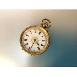 A Swiss lady's 18ct gold keyless wind fob watch, c. 1900, the gilt-highlighted white enamel dial