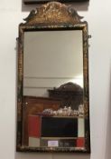 A small Chinoiserie lacquered mirror in 18th century style, early 20th century, the fret-carved