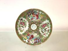 A Canton famille rose porcelain plate made for the Persian market, 19th century, the central reserve