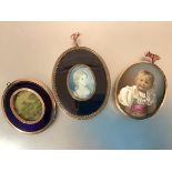 English School, c. 1800, a portrait miniature of a young girl, watercolour on ivory, oval, in a