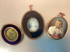 English School, c. 1800, a portrait miniature of a young girl, watercolour on ivory, oval, in a