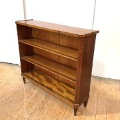 A Sheraton Revival mahogany open low bookcase, c. 1900, the breakfront top over two adjustable