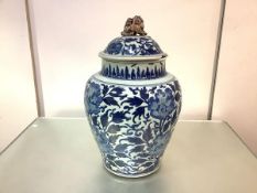 A large Chinese blue and white porcelain jar and cover, 19th century, of baluster form, the domed